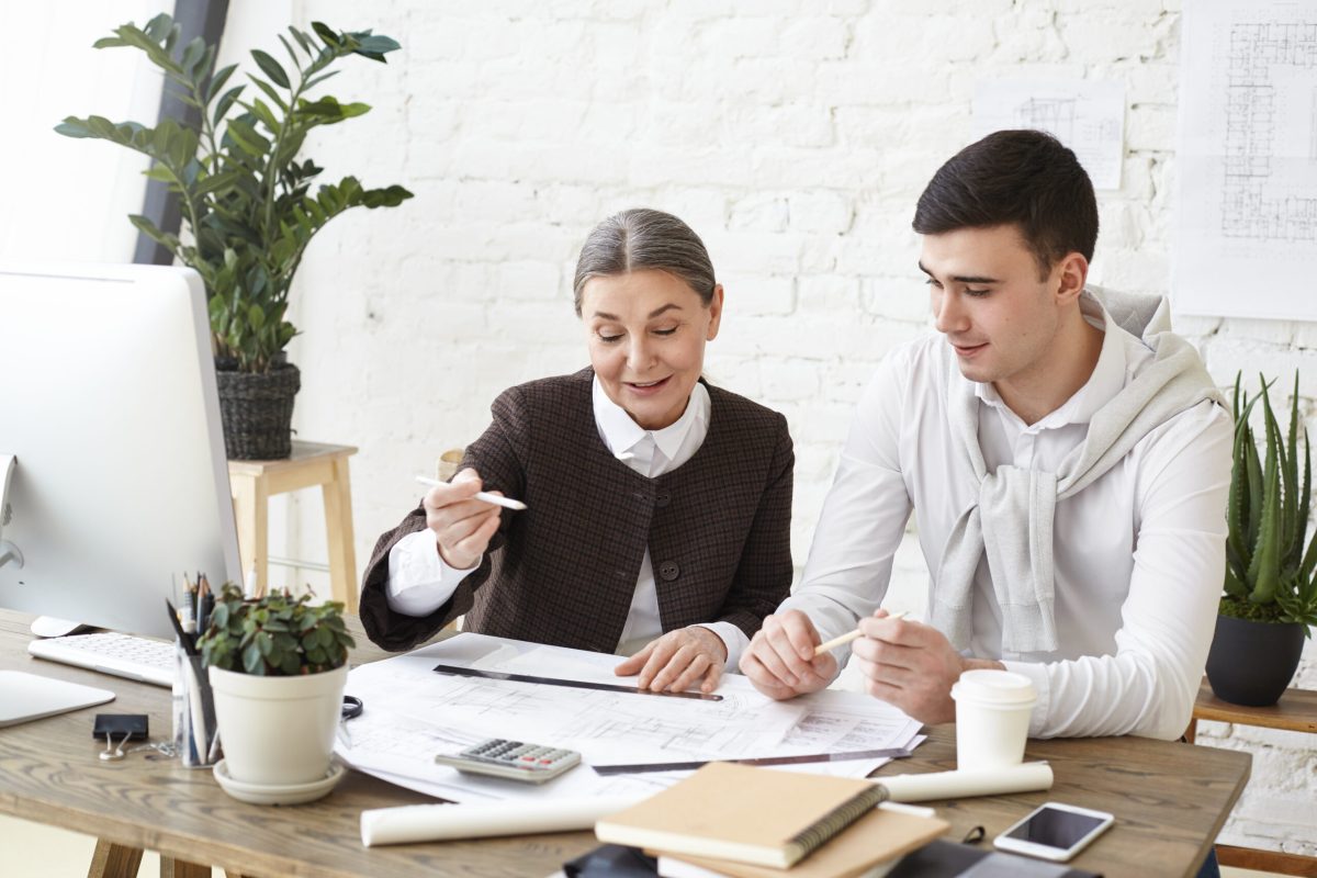 Business professionals preparing records for bookkeeping consultation