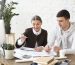 Business professionals preparing records for bookkeeping consultation